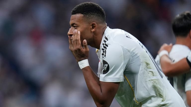 Real Madrid's Kylian Mbappe celebrates after scoring from a penalty...