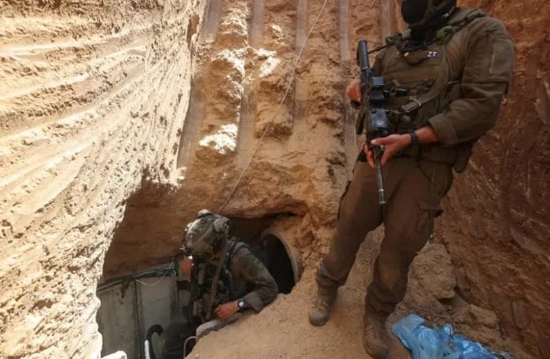 Israeli soldiers walk out from a tunnel underneath the European Hospital in Khan Yunis in the Gaza Strip, June 8, 2025. (credit: REUTERS/Ronen Zvulun)