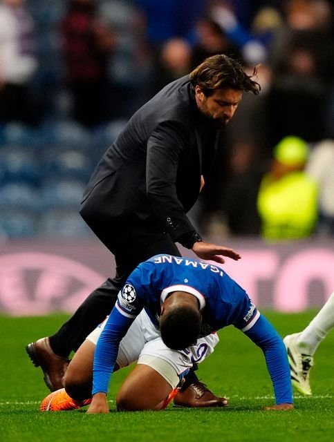 Rangers manager Russell Martin (top) pats Hamza Igamane on the back as he climbs off the the turf after final whistle. Photo: PA Wire
