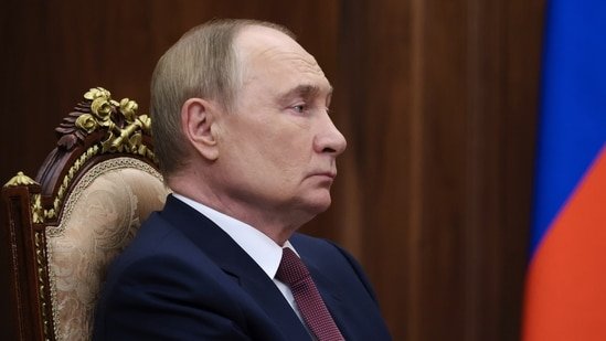 Russian President Vladimir Putin listens to acting governor of the Rostov region Yuri Slyusar during their meeting at the Kremlin in Moscow, Russia, Monday, Aug. 18, 2025. AP/PTI(AP08_19_2025_000010B)(AP)