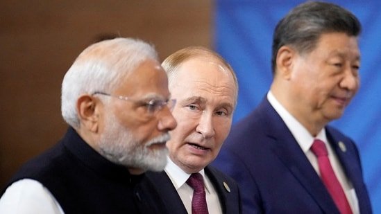 Prime Minister Narendra Modi, Russian President Vladimir Putin and Chinese President Xi Jinping attend a family photo ceremony prior to the BRICS Summit plenary session in Kazan, Russia, on October 23, 2024. (REUTERS)