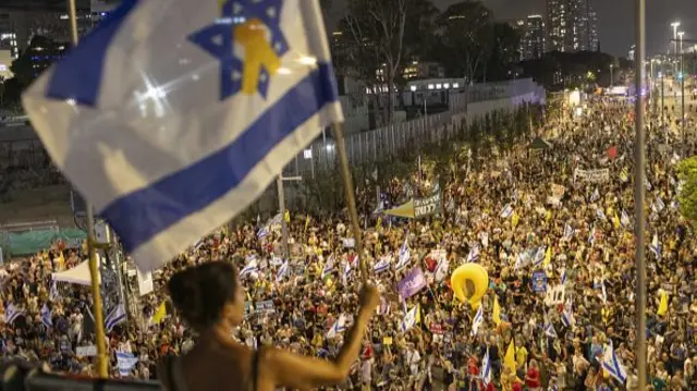 Israeli protesters take part in a demonstration calling for the release of hostages and an end to the war in Gaza, in Tel Aviv