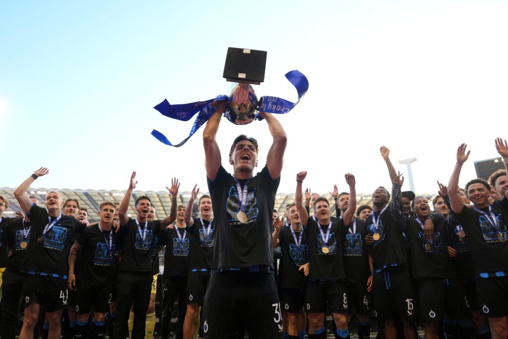 BRUSSELS, BELGIUM - MAY 04: Ardon Jashari #30 of Club Brugge KV lifts the Croky Cup trophy after Club Brugge KV defeated RSC Anderlecht 2-1 in the Croky Cup Final at King Baudouin Stadium on May 04, 2025 in Brussels, Belgium. (Photo by Alex Bierens de Haan/Getty Images)