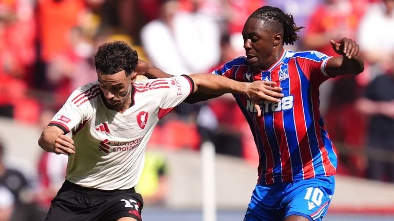 Curtis Jones and Eberechi Eze battle for the ball