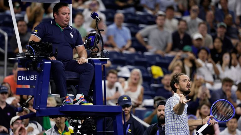 Daniil Medvedev, of Russia, bottom right, reacts next to chair umpire, Greg Allensworth, left, after a photographer ran onto the court durin