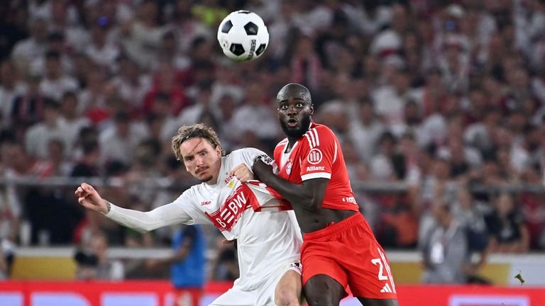 Stuttgart's Nick Woltemade duels against Bayern Munich's Dayot Upamecano in the Franz Beckenbauer Supercup