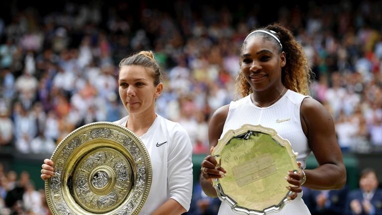 Simona Halep and Serena Williams present their trophies