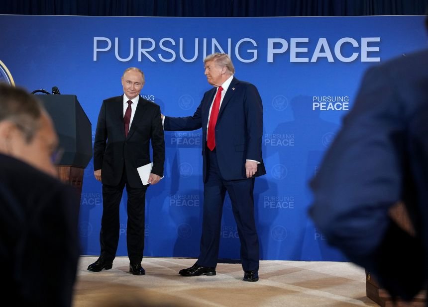 US President Donald Trump and Russian President Vladimir Putin leave following a press conference at their Alaska summit on August 15, 2025.