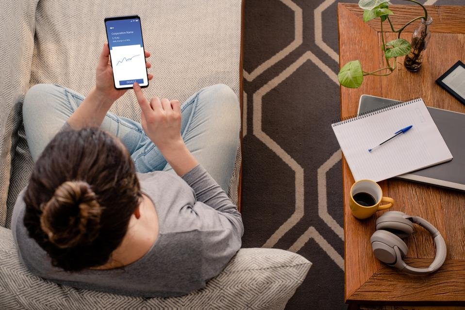 Woman using investment mobile app