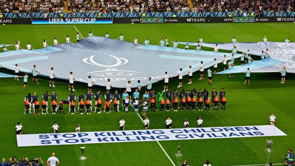 FILE - The players line up before the UEFA Super Cup soccer match between Paris Saint-Germain and Tottenham Hotspur in Udine, Italy, Wednesday, Aug. 13, 2025.