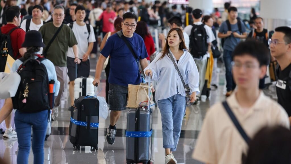 Travellers return to Hong Kong airport as flights resume after Ragasa disruptions