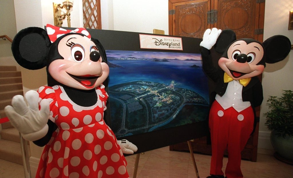 Minnie and Mickey Mouse with a rendering of the planned Hong Kong Disneyland, in Penny’s Bay, Lantau Island, in 1999. Photo: SCMP Archives