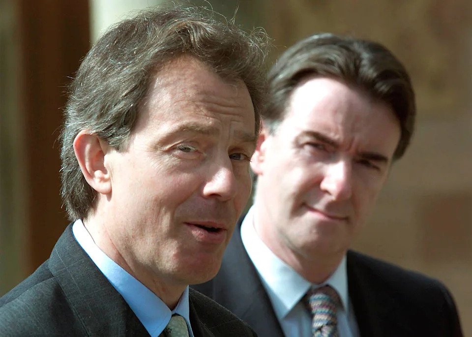 Britain's Prime Minister Tony Blair, left and the Northern Ireland Secretary of State Peter Mandelson speak to media on their arrival to Hillsborough Castle, Belfast, Tuesday April 18, 2000. Blair arrived to try and resolve the current impasse in the peace process and was due to meet with Protestant and Catholic politicians. (AP Photo/Peter Morrison)