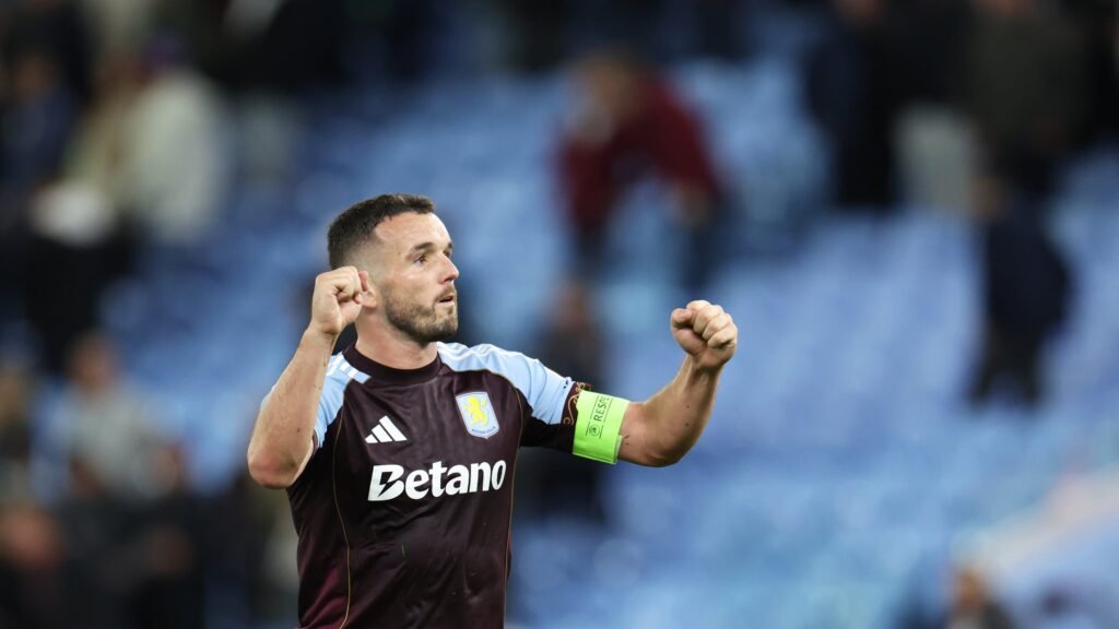 Aston Villa's John McGinn celebrates at the end of the Europa League soccer match between Aston Villa and Bologna at Villa Park stadium in Birmingham, England, Thursday, Sept. 25, 2025. (AP Photo/Darren Staples)