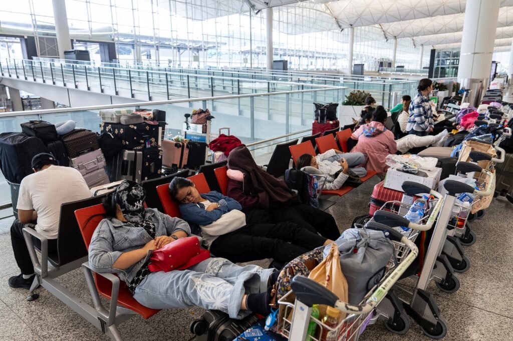 Passengers rest at the Hong Kong International Airport