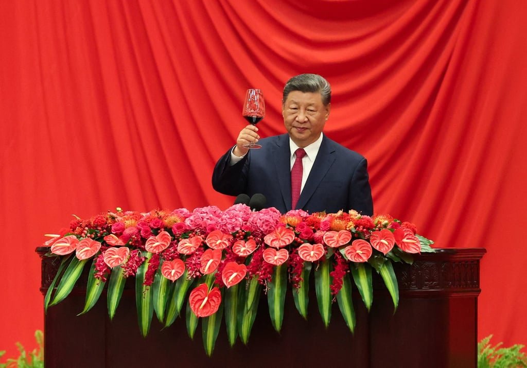 President Xi Jinping raises a glass at a reception on the eve of the 76th anniversary of the founding of the People’s Republic of China. Photo: Reuters