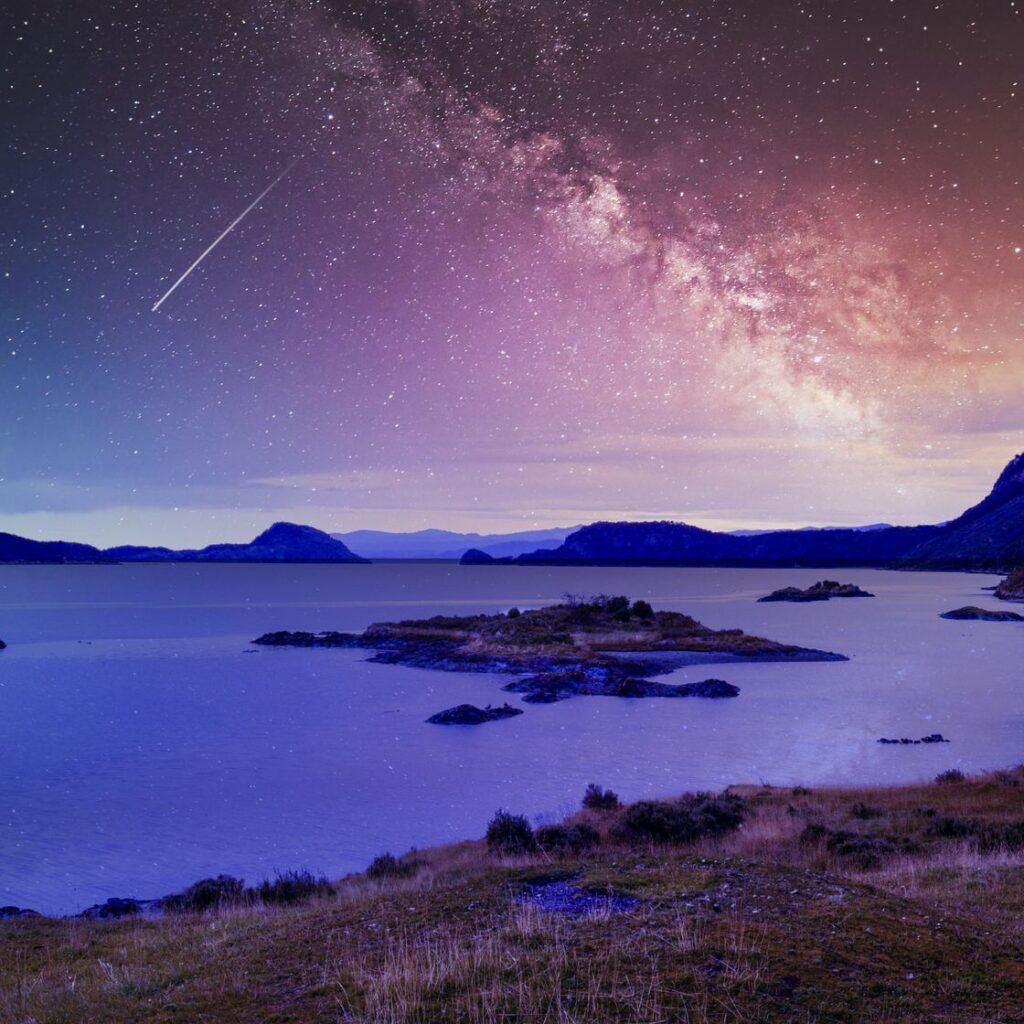 milky way and falling star over the sea