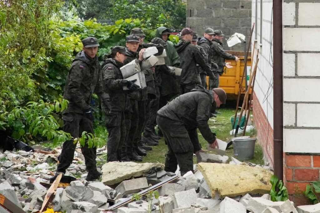 People sort through debris