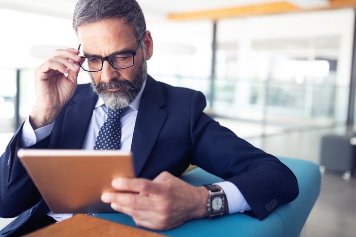 An investor reviews research.