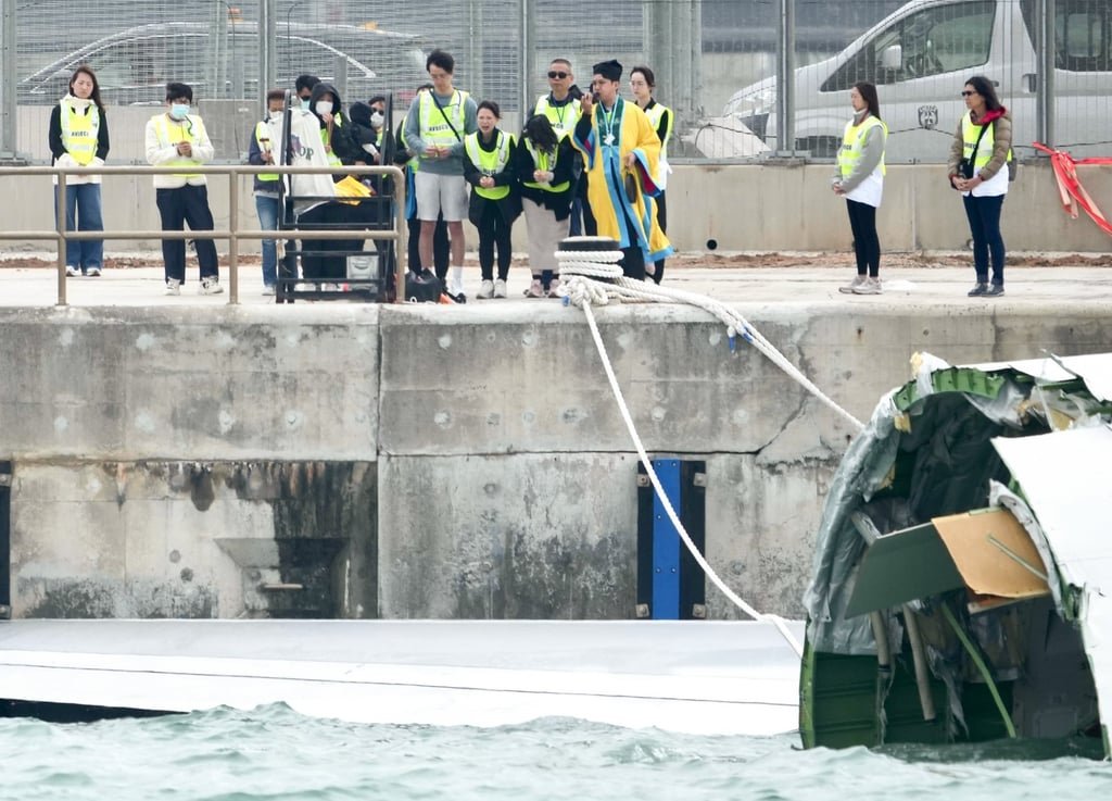 Families of the two victims return to the scene for a ritual mourning ceremony. Photo: Sam Tsang