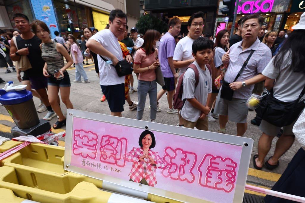 A fan group celebrates lawmaker Regina Ip Lau’s 75th birthday in Causeway Bay on August 24. The celebration, organised by a Facebook group of supporters, drew a sizeable and enthusiastic crowd outside Causeway Bay’s Sogo department store. Photo: Dickson Lee