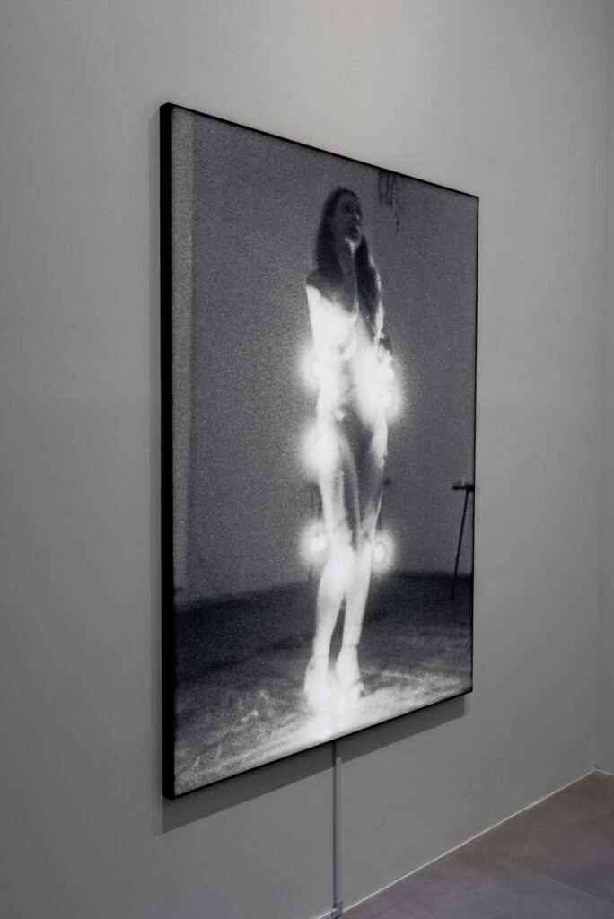 A picture from a 1981 performance of Ewa Partum’s Stupid Woman work, set in a lightbox. Photo: Jocelyn Tam
