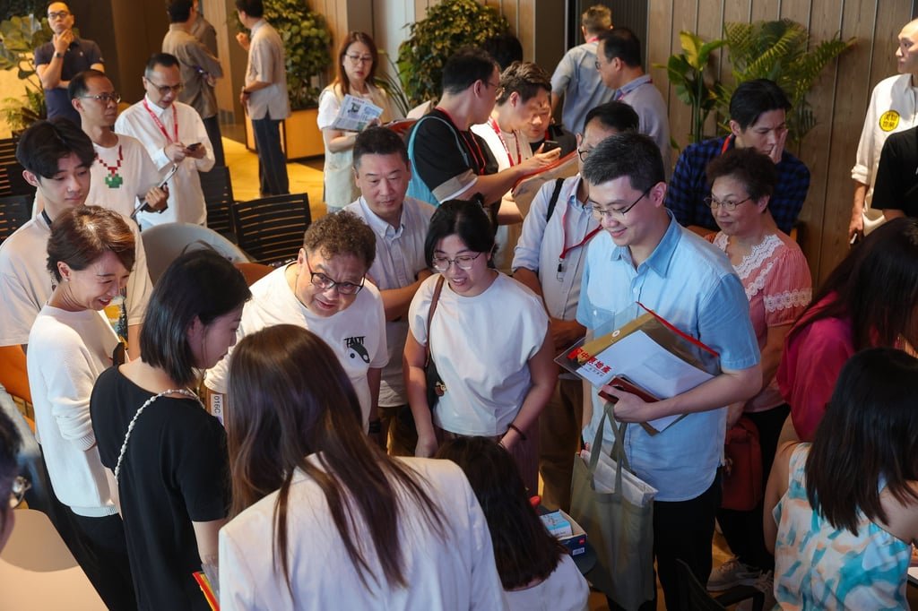 Potential buyers and property agents at the sales office of a Wan Chai residential project. Photo: Edmond So