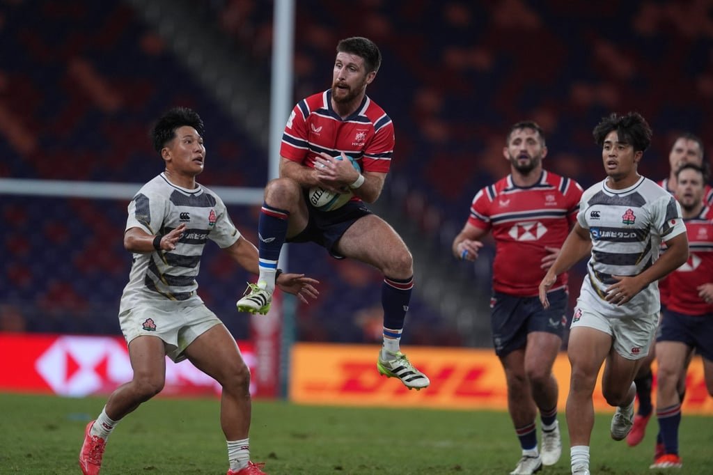 Hong Kong’s Gregor McNeish claims the ball during the second half against Japan. Photo: Elson Li