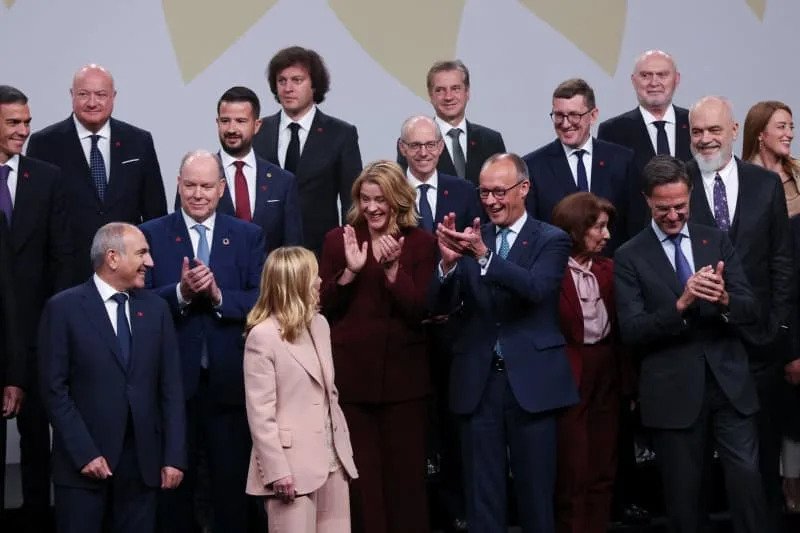 Italian Prime Minister Giorgia Meloni, German Chancellor Friedrich Merz, The North Atlantic Treaty Organization (NATO) Secretary General Mark Rutte, Spanish Prime Minister Pedro Sanchez and Albania's Prime Minister Edi Rama react as they and other leaders pose for a family photo at the 7th European Political Community (EPC) Summit at the Bella Center in Copenhagen. Suzanne Plunkett/PA Wire/dpa