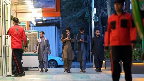 Some residents of Herat and Kandahar travelled to border towns to pick up signal from neighbouring Iran and Pakistan.(AFP)