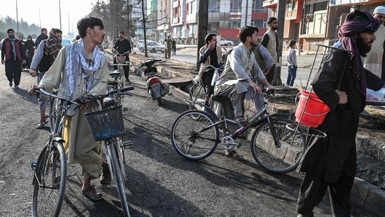 Afghan residents look at the site of an airstrike in Kabul.(AFP)