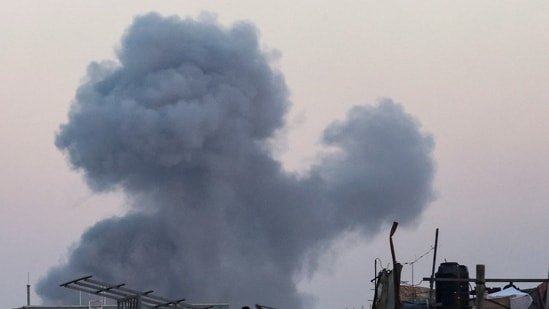 Smoke rises following an Israeli airstrike in Khan Younis, southern Gaza Strip.(REUTERS)