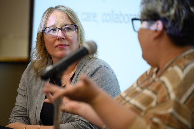 Goodwill Industries Nurse-Family Partnership Administrator Erin Stojic listens as Dunebrook outreach coordinator and certified breastfeeding specialist Amy Straka Wisor speaks about her experience with the Nurse-Family Partnership program during a Q+A session at the World Food Day event at Indiana University Northwest on Thursday, Oct. 16, 2025. (Kyle Telechan/for the Post-Tribune)