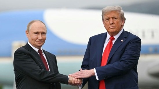 US President Donald Trump greets Russian President Vladimir Putin on the tarmac after they arrived at Joint Base Elmendorf-Richardson in Anchorage, Alaska, on August 15, 2025.(AFP)