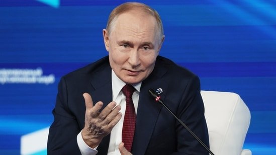 Russian President Vladimir Putin gestures as he answers questions during a meeting with foreign policy experts at the Valdai Discussion Club in the Black Sea resort of Sochi on Thursday, (AP)