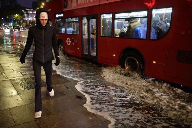 ??George Cracknell Wright 23/10/2025 London, United Kingdom Storm Benjamin Vehicles and cyclists attempt to navigate a partially flooded section of road near Euston Station in central London as Storm Benjamin arrives in the UK. Storm Benjamin is forecasted to bring strong winds and heavy rain to much of the south of the United Kingdom with yellow weather warning for wind and rain in place. Photo Credit: George Cracknell Wright