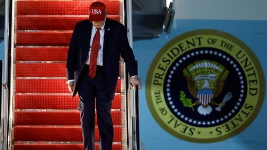 President Donald Trump walks down the stairs of Air Force One upon his arrival at Joint Base Andrews.(AP)