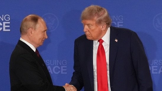 FILE - President Donald Trump, right, shakes the hand of Russia's President Vladimir Putin during a joint press conference at Joint Base Elmendorf-Richardson, Alaska, Aug. 15, 2025.(AP File)