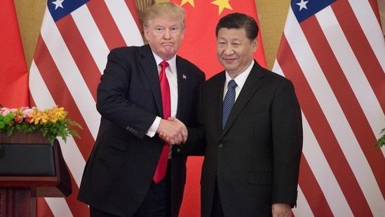 US President Donald Trump (L) shakes hands with China's President Xi Jinping during a press conference at the Great Hall of the People in Beijing on November 9, 2017.(AFP)