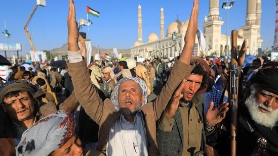 Supporters of Yemen's Huthis gather to celebrate the ceasefire in the Gaza Strip, in Sanaa on October 10, 2025.(AFP)