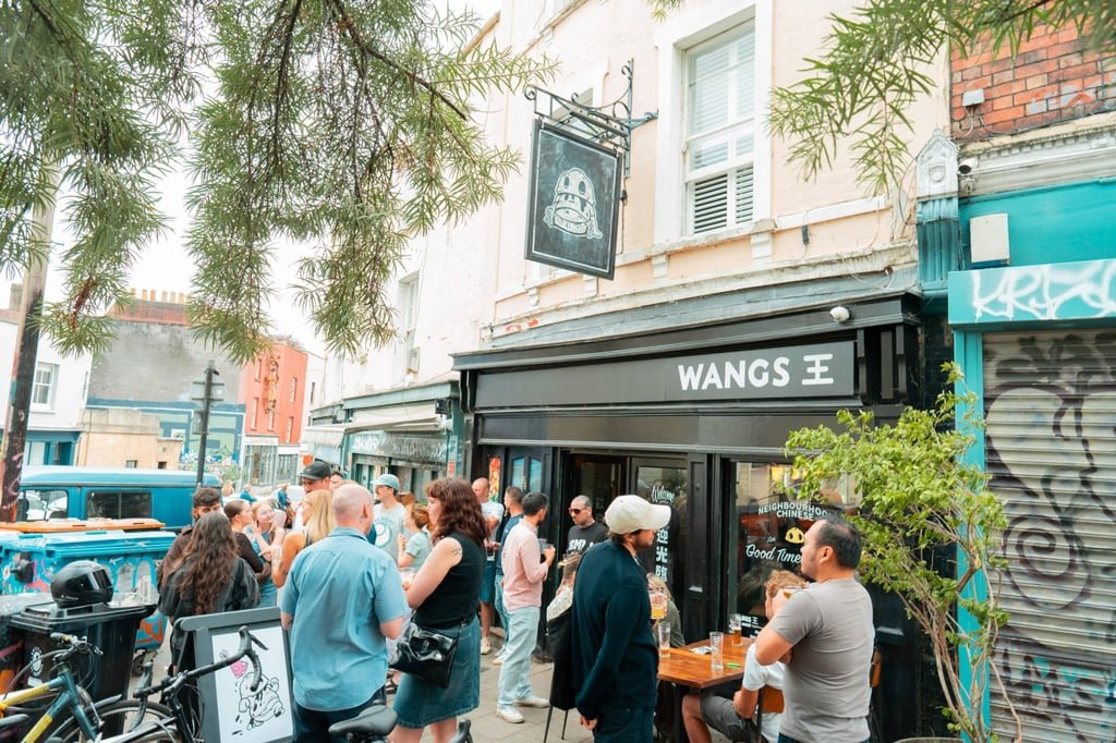 Customers gather outside Wangs. Photo: Wangs