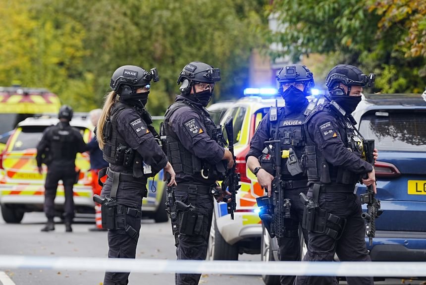 Armed police officers at the scene near the Heaton Park Hebrew Congregation synagogue in Manchester, England, on Thursday.