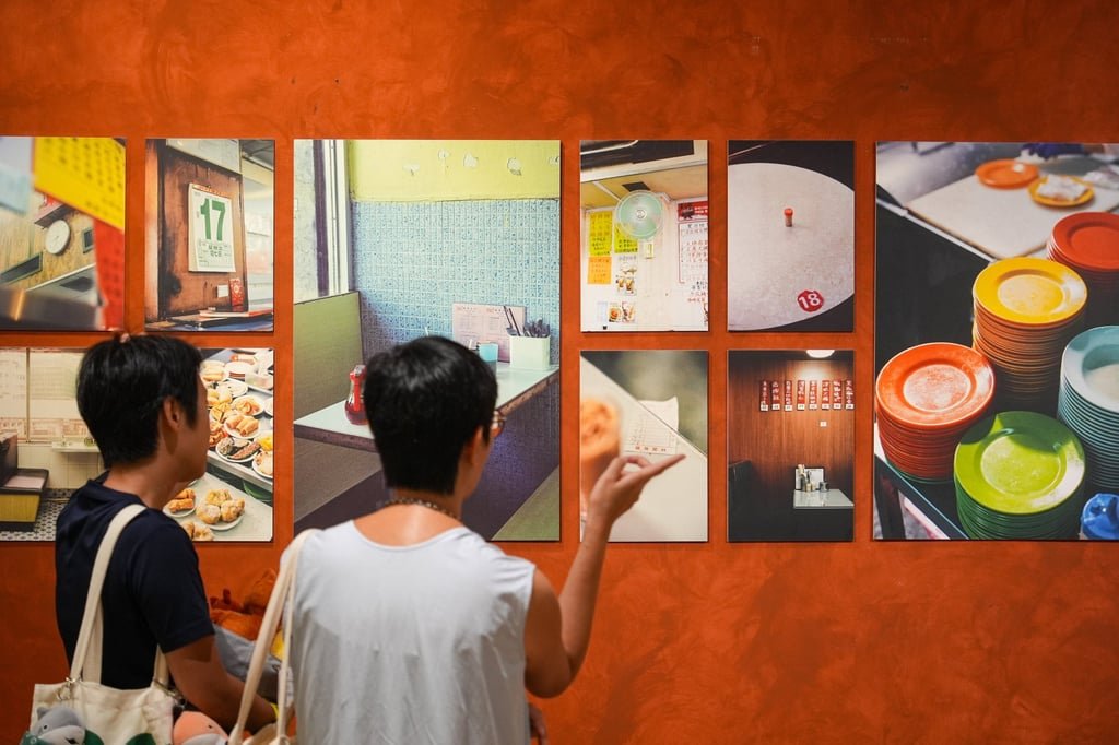 Visitors browse works at the “Jo Cha Photography Club” exhibition at the K11 Art Mall’s How To Live Well store. Photo: Eugene Lee