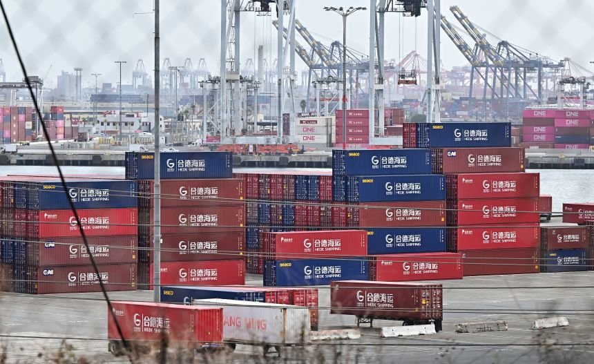 Shipping containers from Hede Shipping, from the Chinese state-owned Hebei Port Group, are seen stacked at the Port of Los Angeles in Los Angeles, California on October 13, 2025.