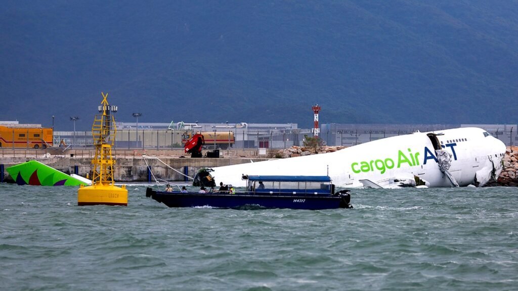 plane partly submerged in sea