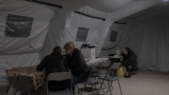 Tetiana Torba and her niece, Viktoriia Raiska, at a resilience center.