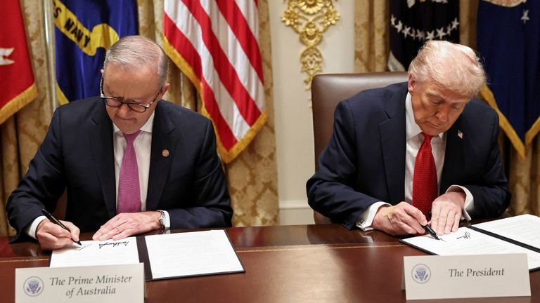 US President Donald Trump and Australia's Prime Minister Anthony Albanese sign a rare earth and critical minerals deal on 20 October. Pic: Reuters