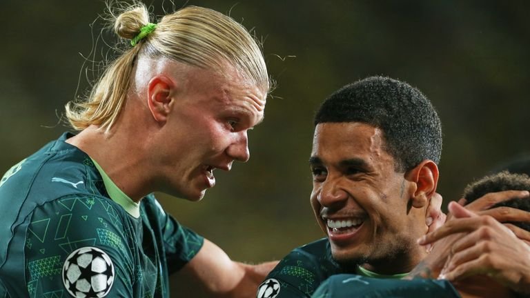 Manchester City's Erling Haaland celebrates with team-mates after scoring a goal against Villarreal