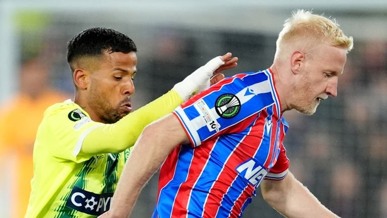 AEK Larnaca's Gus Ledes (left) and Crystal Palace's Will Hughes (right) battle for the ball during the UEFA Conference League match