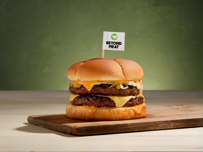 A Beyond Burger with a Beyond Meat flag in it.